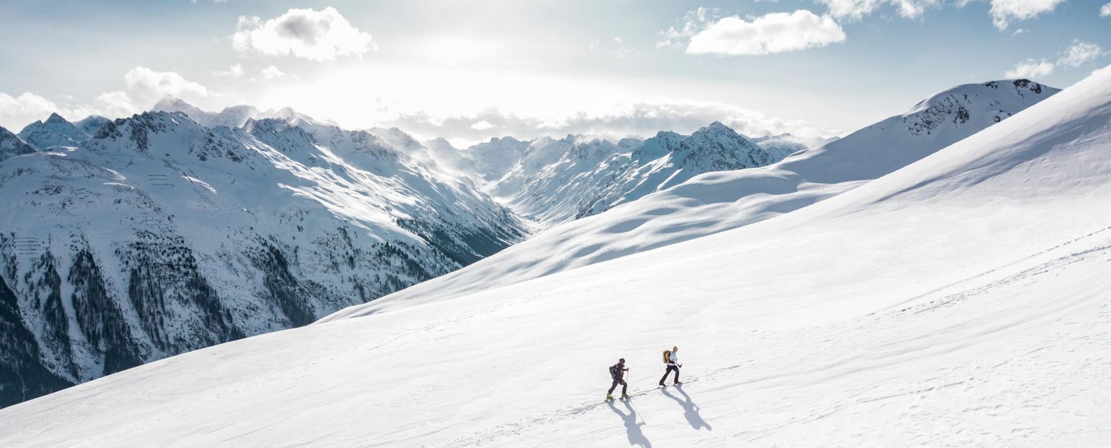 Skiiers on the way to the top